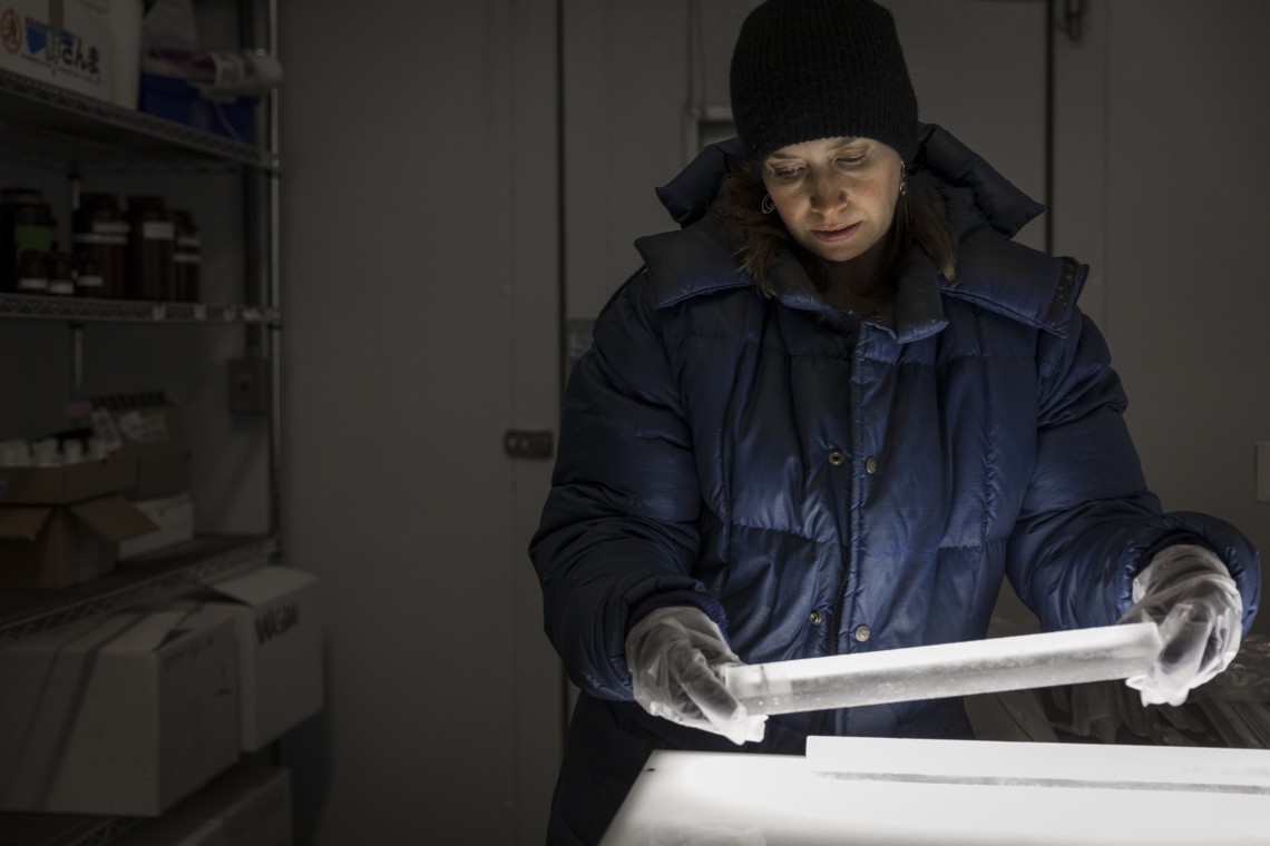 Becky Alexander in the cold room of the UW’s IsoLab with sections of an ice core. Her group is now analyzing ice cores from Antarctica to see if they show the same trend as in Greenland. Image credit: Mark Stone/University of Washington